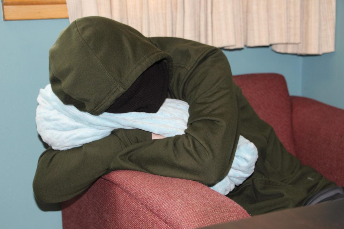 A senior in years past rests before the start of class in a classroom at Auburn Riverside.