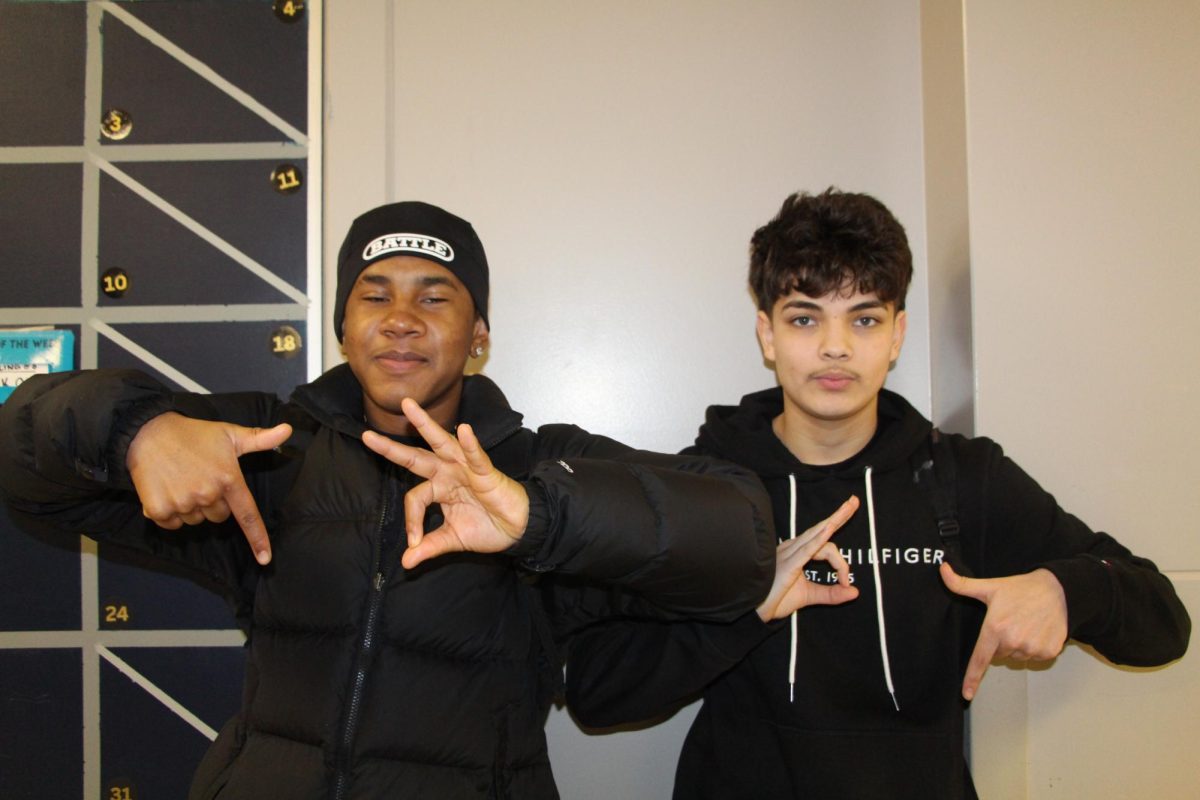 Riverside students Jaiden Drinker and Gadiel Anguloromero illustrate a popular phrase among teens: "Six, seven." 