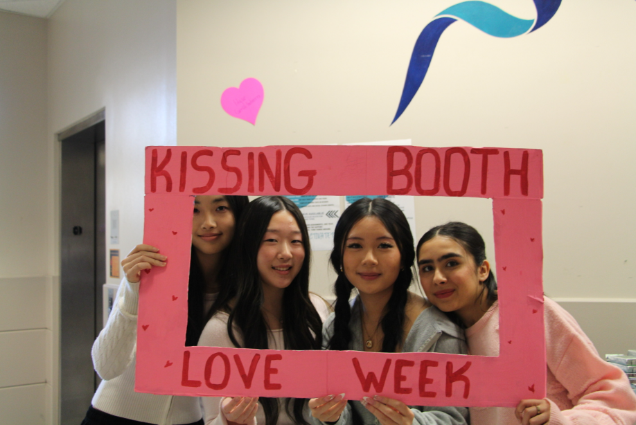 Auburn Riverside students pose for a photo at the "Kissing Booth" that was set up during "Love Week" this week in the Commons.